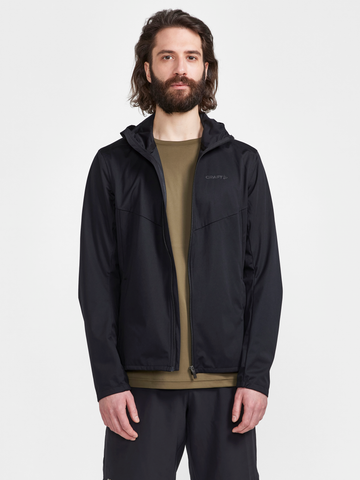 Man models a black zip-up athletic jacket with hood.