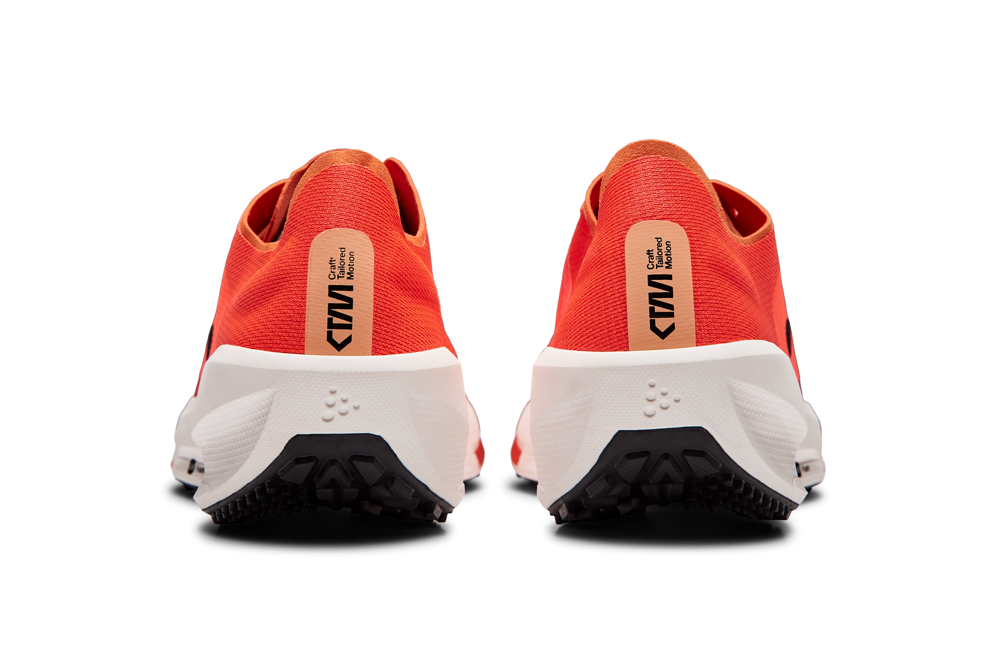 Red Craft CTM running shoes showcase their white soles and unique tread pattern.