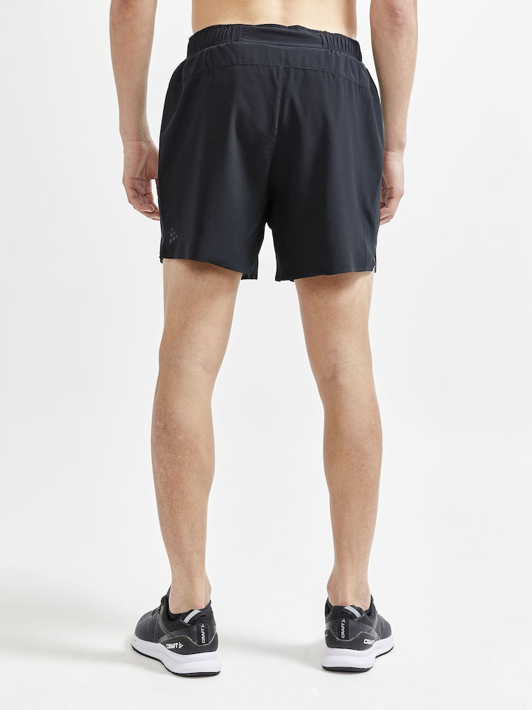 Man models black running shorts from the back, highlighting the breathable fabric and comfortable fit.