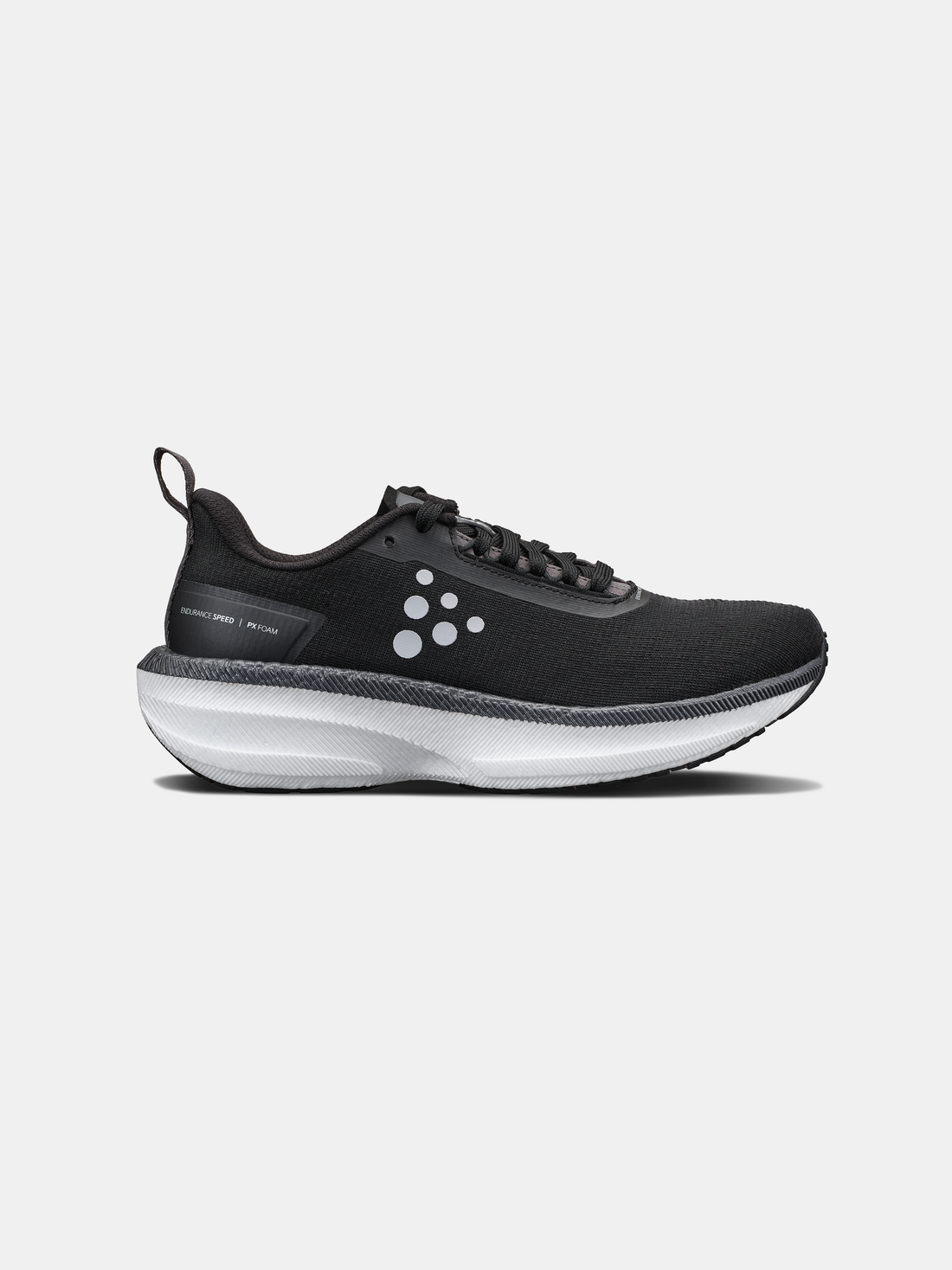 Black Craft Sportswear running shoe with white cushioned sole and black laces. 
